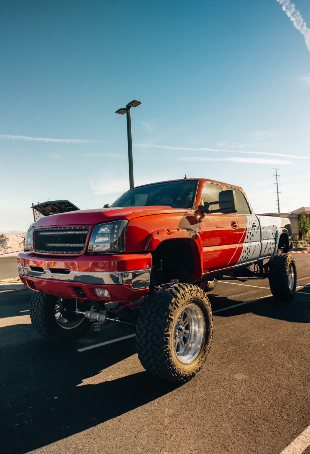 Lifted custom red Chevrolet truck built in Las Vegas